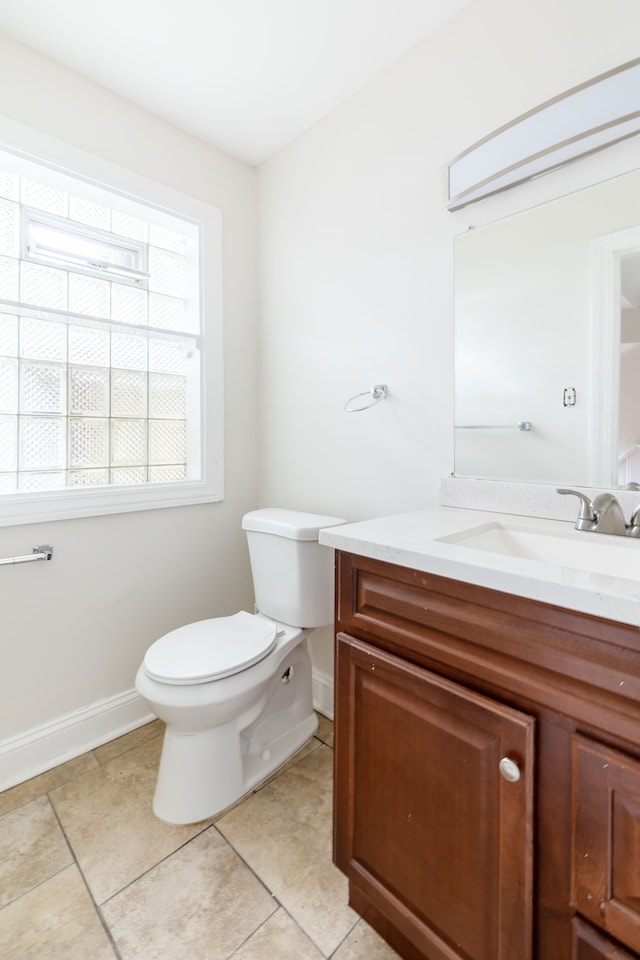 bathroom with tile patterned floors, vanity, and toilet