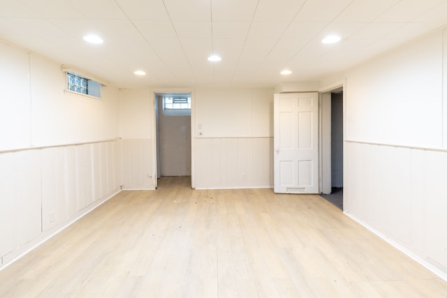 basement featuring light hardwood / wood-style floors