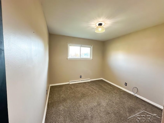 empty room with carpet and a baseboard radiator