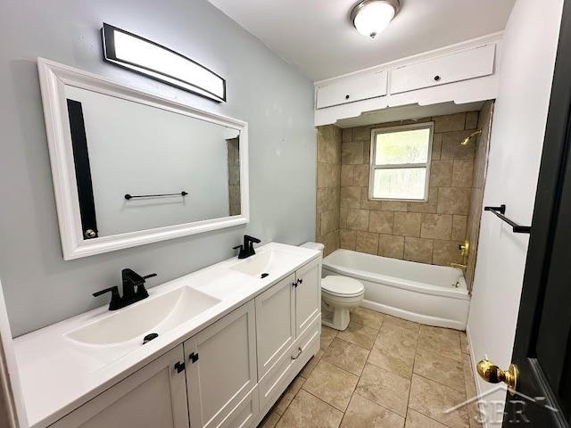 full bathroom featuring vanity, tiled shower / bath combo, and toilet