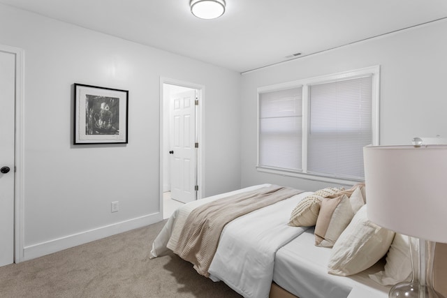 bedroom with light carpet