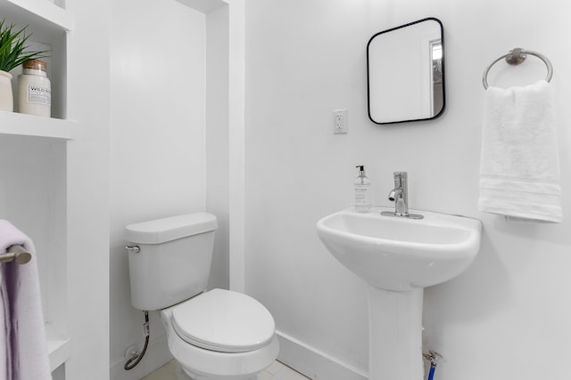 bathroom with tile patterned flooring and toilet