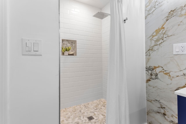 bathroom with a shower with curtain and vanity