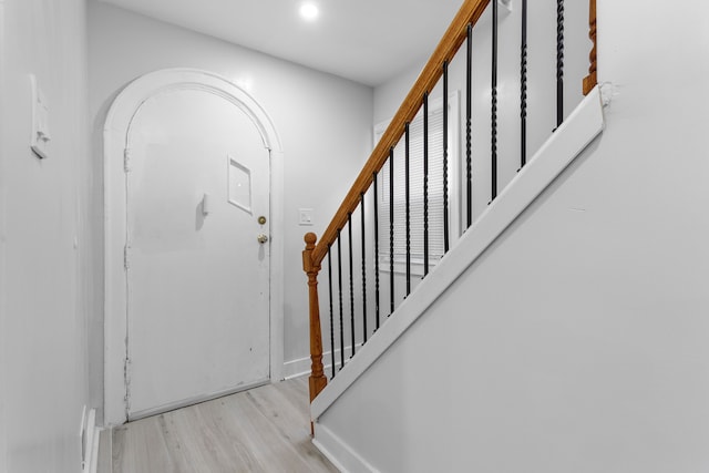 foyer entrance with light hardwood / wood-style floors