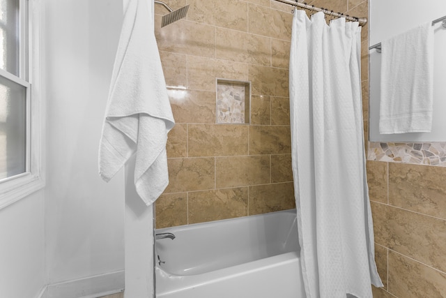 bathroom with shower / tub combo