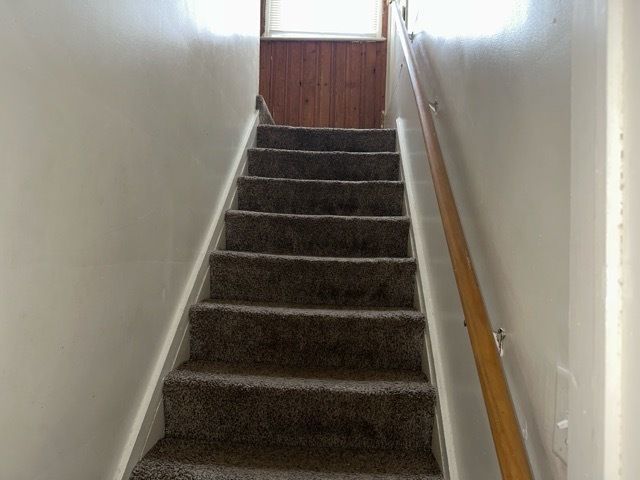 20543 Waltham St, Detroit, MI 48205 - stairs featuring baseboards
