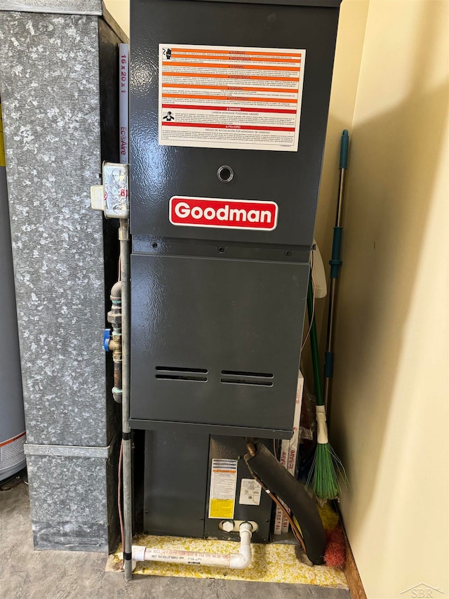 utility room featuring heating unit