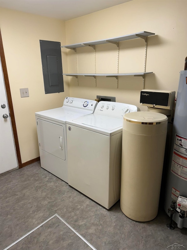 washroom with gas water heater, washing machine and dryer, and electric panel