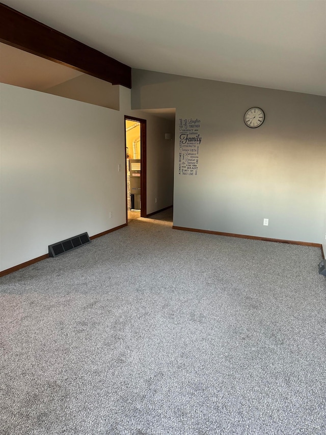 unfurnished room featuring vaulted ceiling with beams and carpet floors