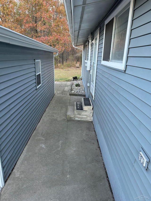 view of side of property featuring a patio