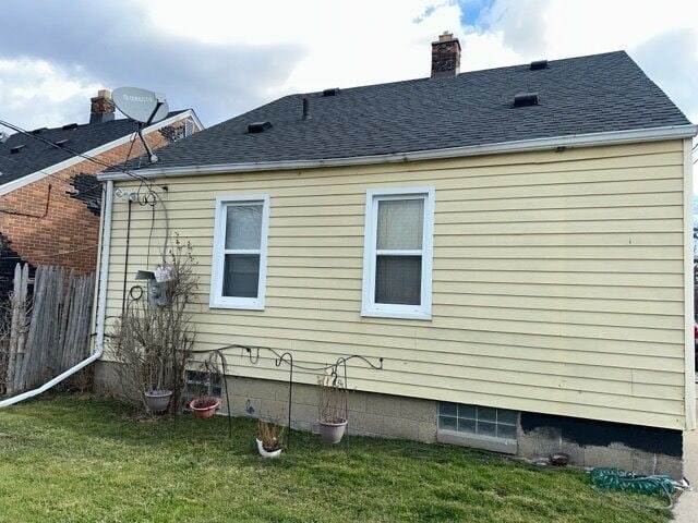 17665 Runyon St, Detroit, MI 48234 - view of property exterior with a chimney