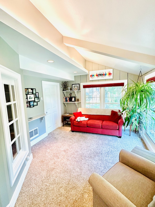 living room with carpet flooring and lofted ceiling