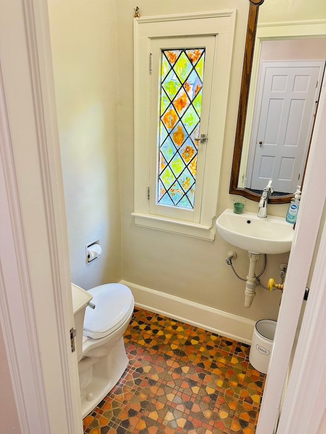 bathroom with toilet and sink