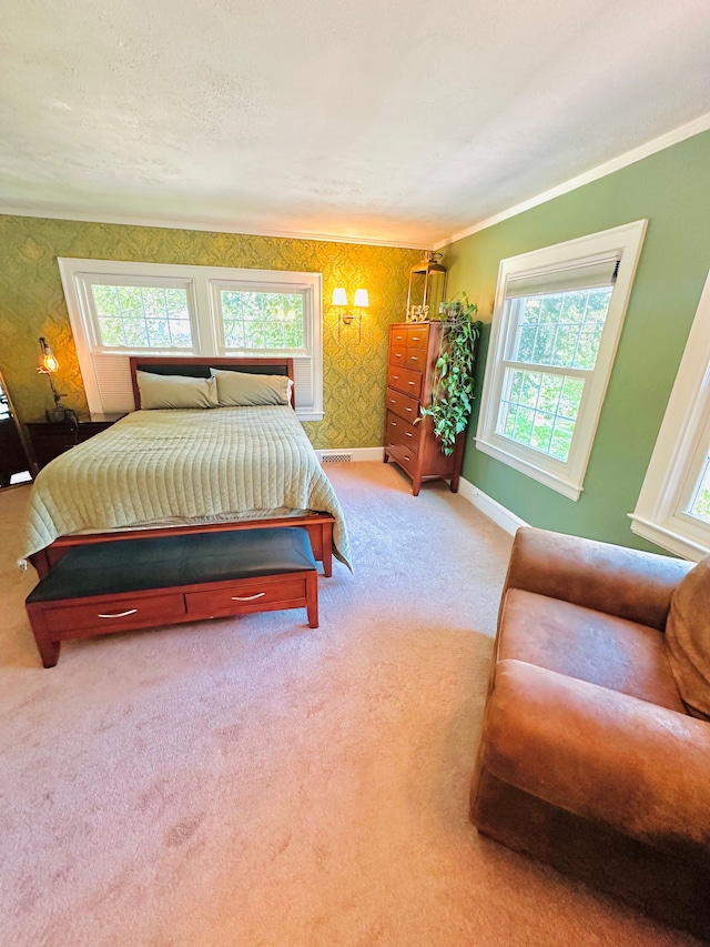 carpeted bedroom with ornamental molding