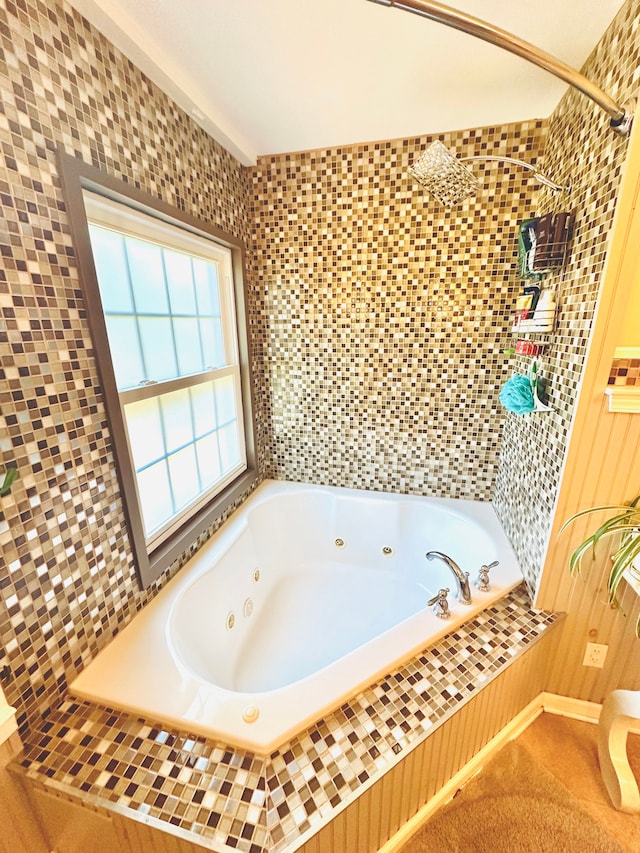 bathroom featuring shower with separate bathtub