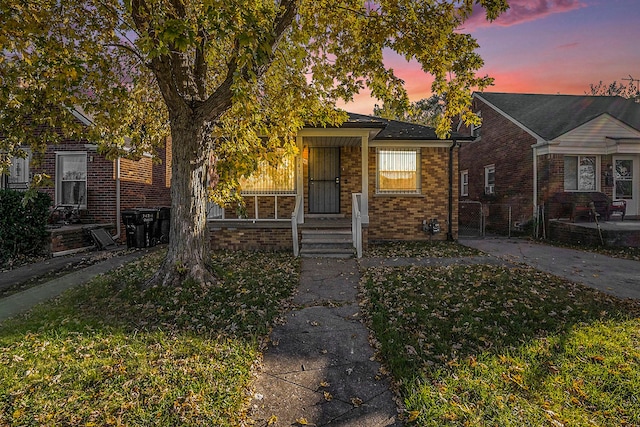 view of front of property with a lawn