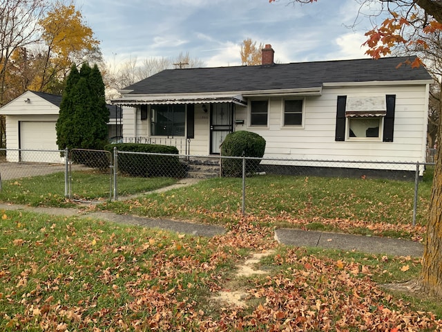 view of front of house with a front lawn and a garage