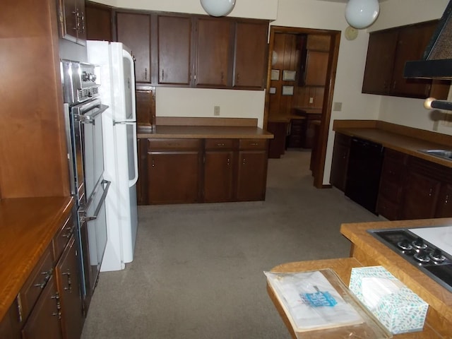 kitchen featuring wood counters, dark brown cabinetry, and black appliances