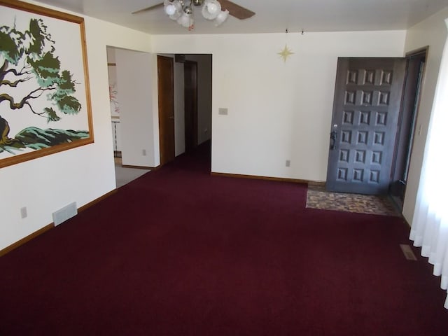 carpeted empty room with ceiling fan