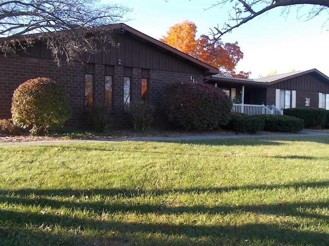 view of property exterior with a yard