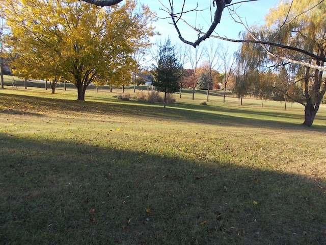 surrounding community featuring a lawn