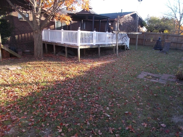 back of house with a yard and a deck