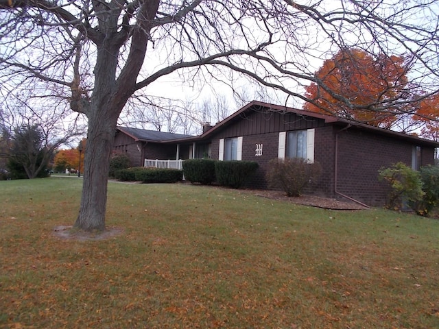 view of home's exterior with a yard