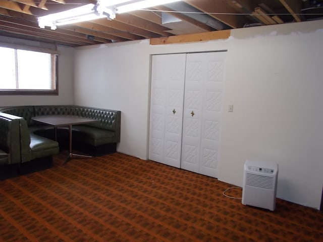 interior space featuring dark carpet