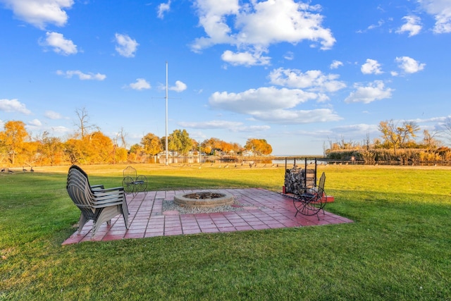 view of yard featuring a fire pit and a patio area