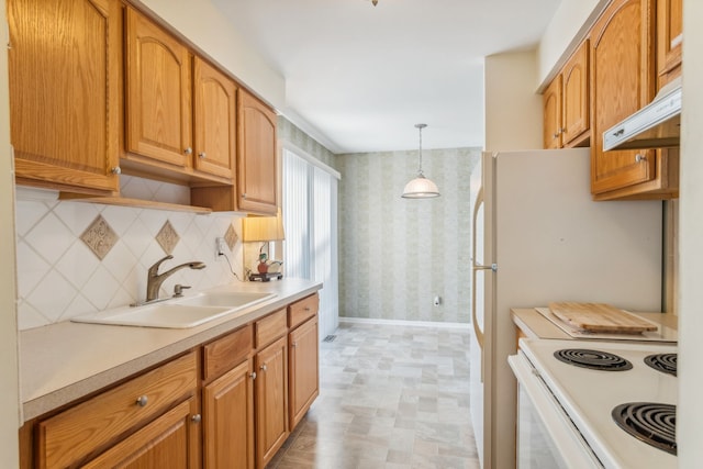 kitchen featuring tasteful backsplash, white range with electric cooktop, decorative light fixtures, and sink