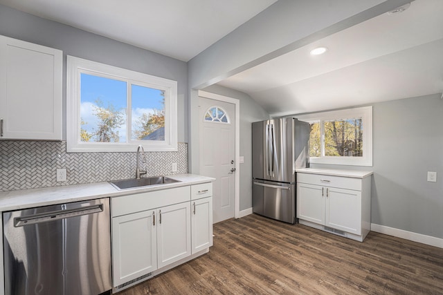 kitchen featuring white cabinets, dark hardwood / wood-style flooring, sink, and appliances with stainless steel finishes