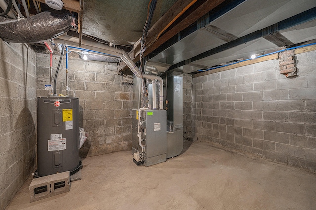 utility room with heating unit and water heater