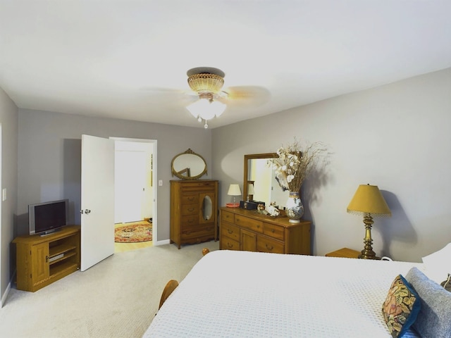 bedroom featuring ceiling fan and light colored carpet