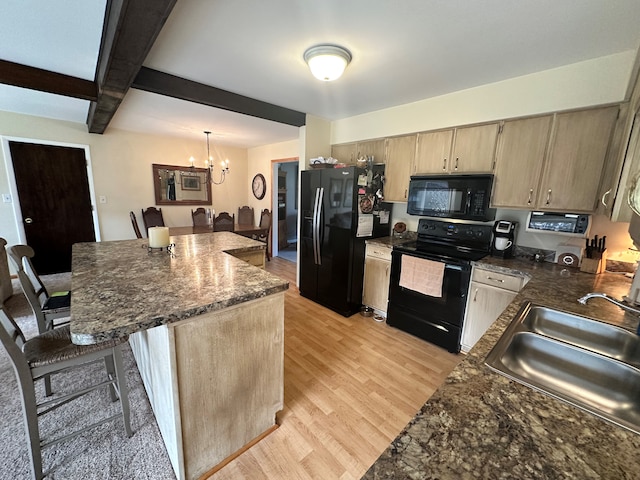 kitchen with light wood-type flooring, sink, black appliances, beam ceiling, and a chandelier