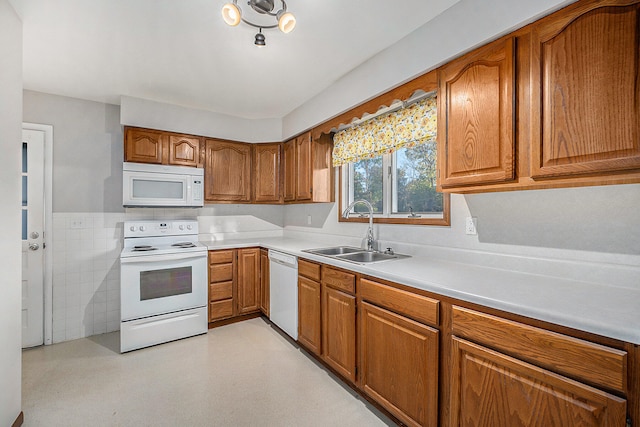 kitchen with white appliances and sink