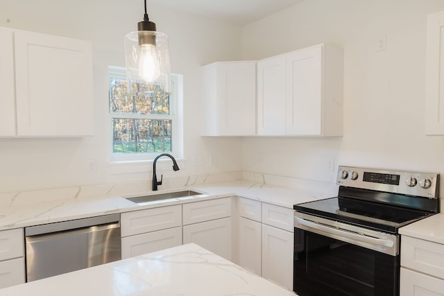 kitchen with light stone countertops, sink, pendant lighting, white cabinets, and appliances with stainless steel finishes