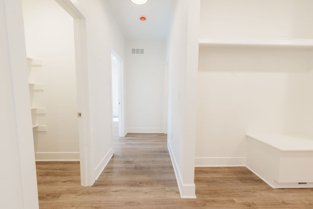 corridor featuring light hardwood / wood-style flooring