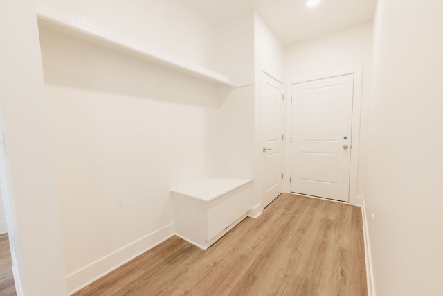 mudroom with light hardwood / wood-style flooring