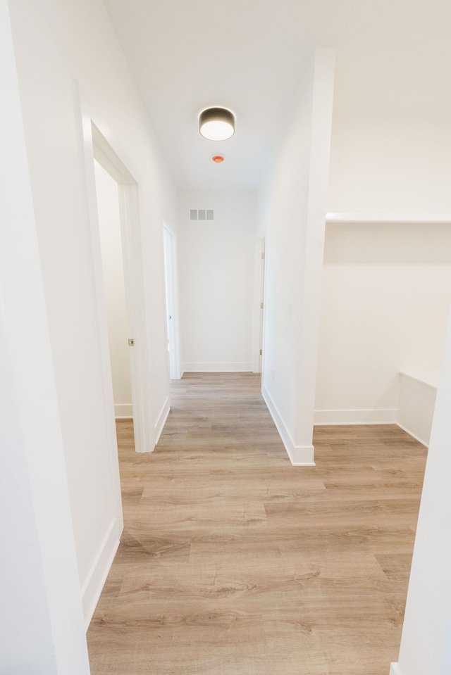 corridor featuring light wood-type flooring