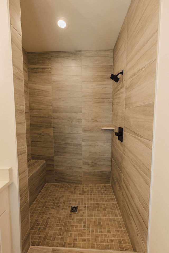 bathroom with a tile shower