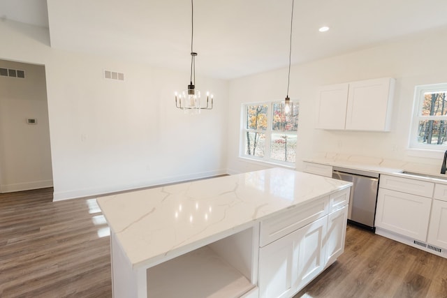 kitchen featuring white cabinets, dark wood-type flooring, sink, dishwasher, and a center island