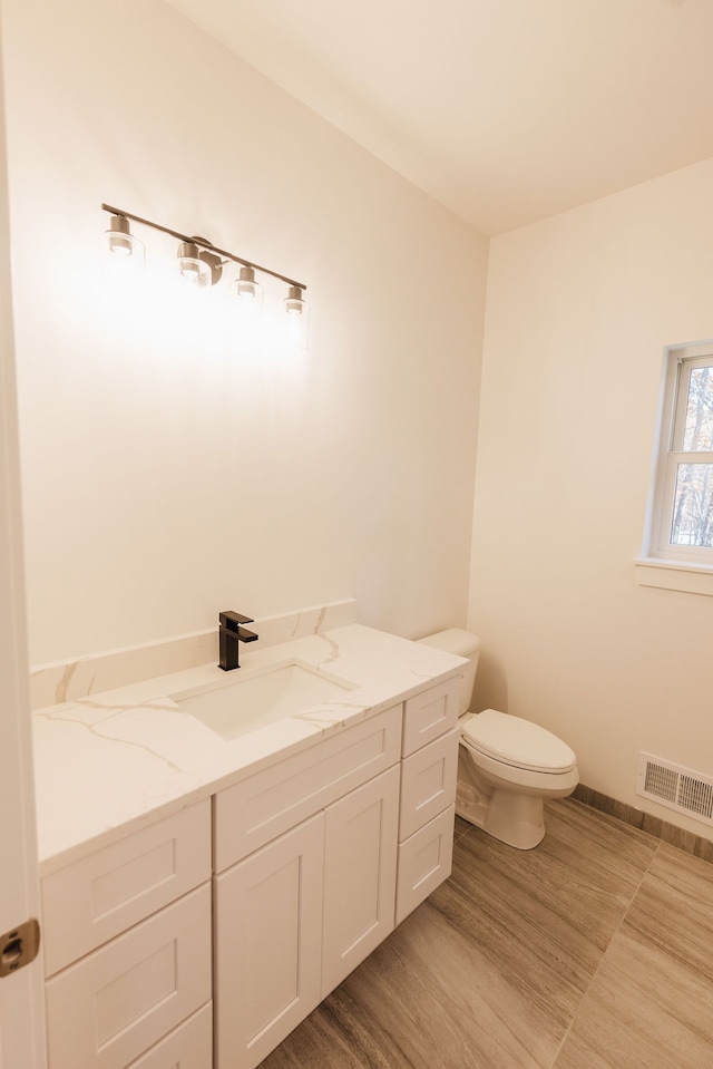 bathroom with vanity and toilet