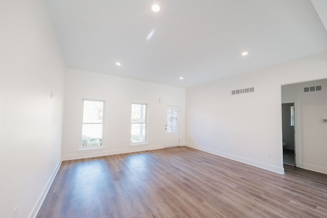 empty room with light hardwood / wood-style floors