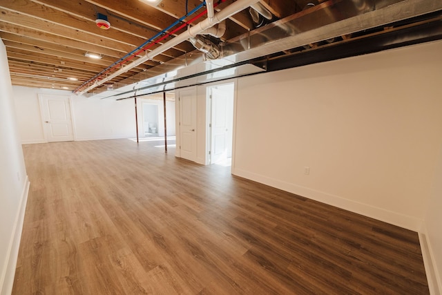 basement with wood-type flooring