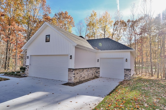 view of side of property featuring a garage