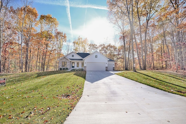 view of front facade featuring a garage and a front lawn