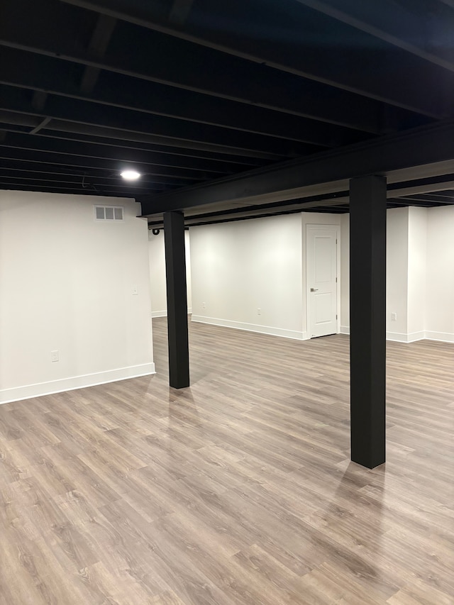 basement with light wood-type flooring