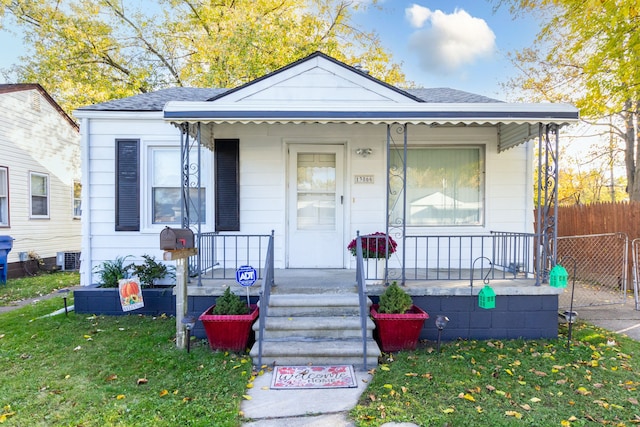 bungalow-style home with a front yard