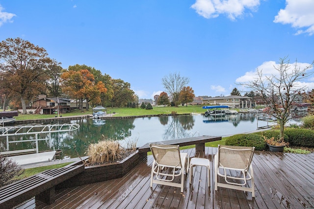 view of dock with a deck with water view