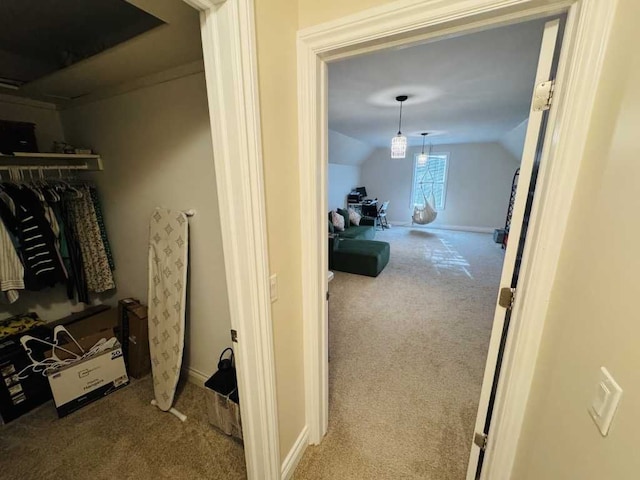 spacious closet with carpet flooring and vaulted ceiling